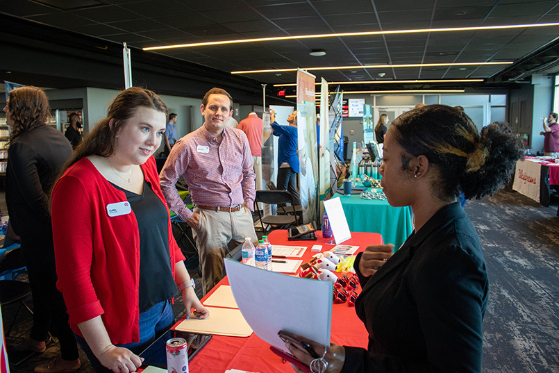 Recruiters from the Target Corporation speak with students about job opportunities at the Experience Expo.
