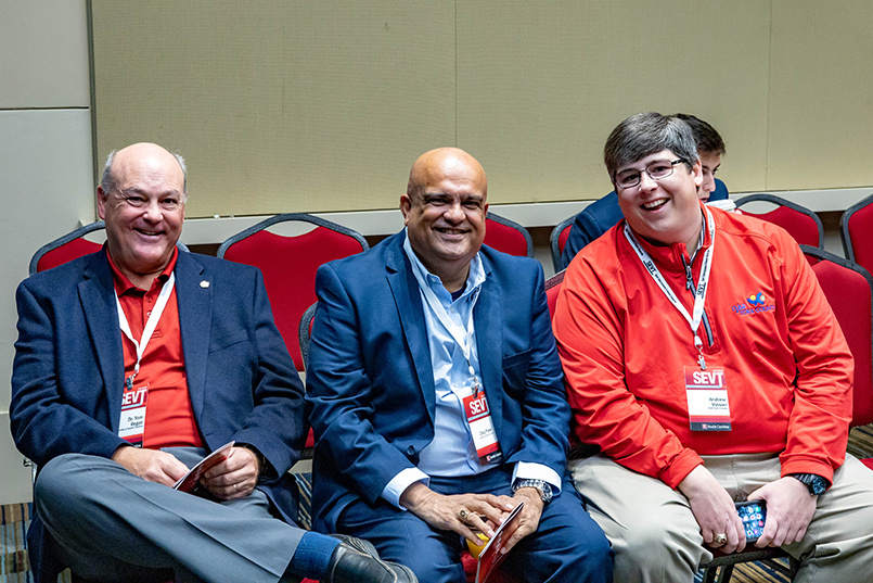 Associate professor Tom Regan poses for a photo with alumnus Dilip Patel and Andrew Vinson of Visit York County at the Sport Entertainment and Venues Tomorrow conference over Nov. 16-18, 2022, at the Columbia Metropolitan Convention Center.