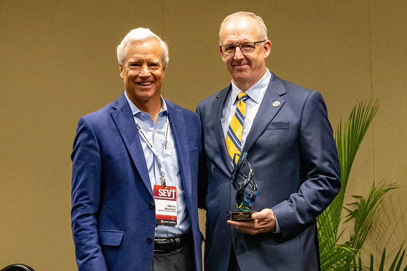 College of HRSM professor of practice Danny Morrison presents SEC commissioner Greg Sankey with the SEVT Lifetime Achievement Award at the Sport Entertainment and Venues Tomorrow conference over Nov. 16-18, 2022, at the Columbia Metropolitan Convention Center.
