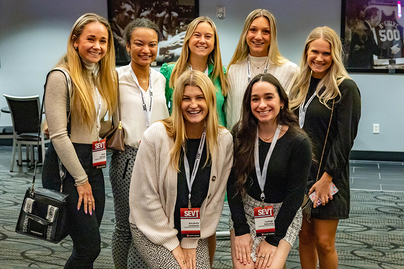 Seven College of HRSM students pose for a photo together at the Sport Entertainment and Venues Tomorrow conference over Nov. 16-18, 2022, at the Columbia Metropolitan Convention Center.