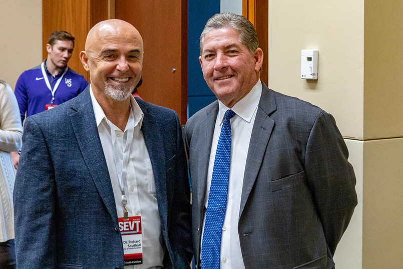Professor Richard M. Southall poses for a photo with University of South Carolina athletics director Ray Tanner at the Sport Entertainment and Venues Tomorrow conference over Nov. 16-18, 2022, at the Columbia Metropolitan Convention Center.