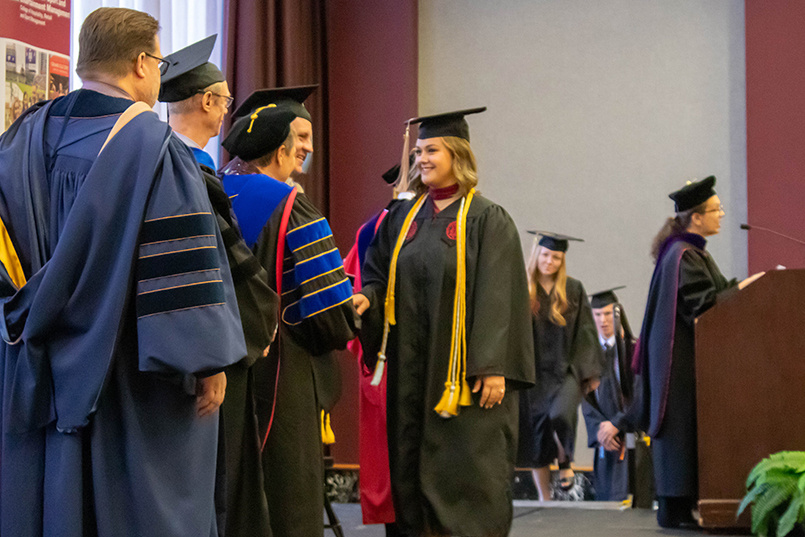 HRSM hosted the annual Hooding and Cording ceremony Monday, Dec. 12, 2022, celebrating December graduates who earned master's degrees, completed undergraduate degrees with honors and/or served in the HRSM Leadership Program.