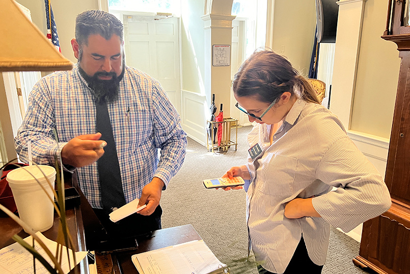 Instructor Christopher Knezevich works with a student as McCutchen House gets ready to open its doors for the spring 2023 semester.