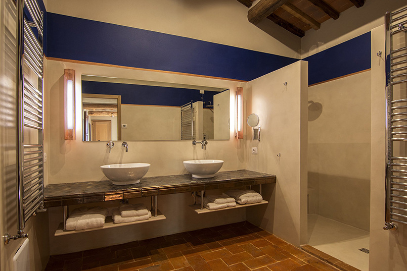 The bathroom area with doubles sinks at a villa in Tuscany
