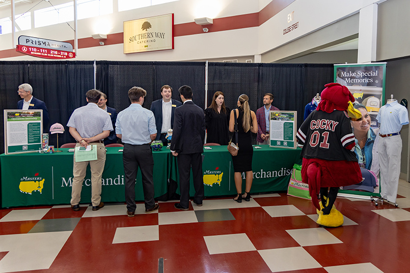A team of reps from Augusta National Golf Club mans a table at Experience Expo to speak with HRSM students about opportunities to work with the organization.
