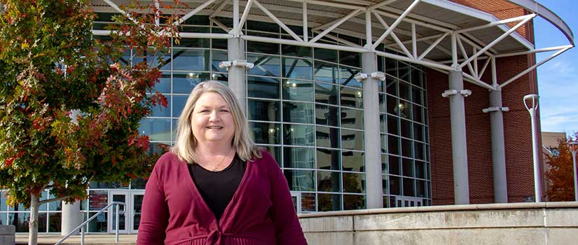 Michelle Knight stands in front of Colonial Life Arena, Columbia's premiere sport and entertainment venue, on a beautiful sunny day.