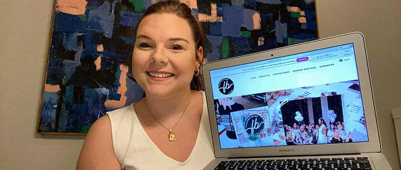 Retailing major Lauren Copeland shows off the web design she created for Fashion Board