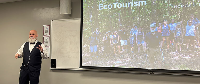 Professor of Practice Tom Mullikan teaches a course on sustainable tourism