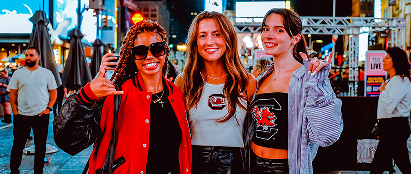 University of South Carolina Department of Retailing students Kieley Gayle, Ainsley Isenhour and Willow Collette pose for a photo in Times Square during New York Fashion Week in September 2022.