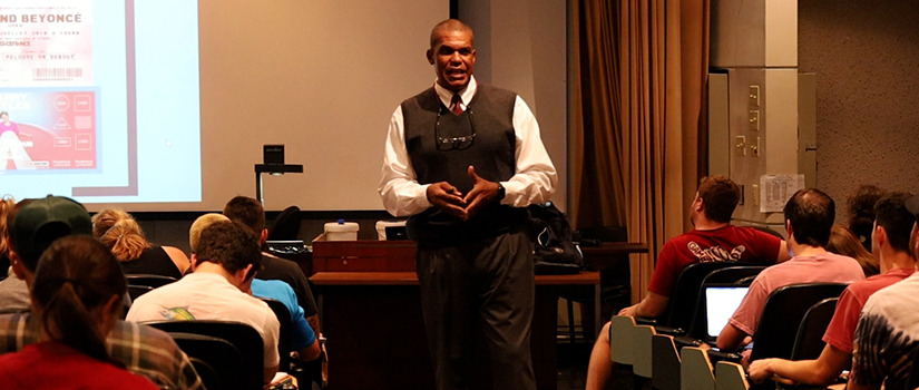 Adonis "Sporty" Jeralds lectures to his class in the Belk Auditorium.