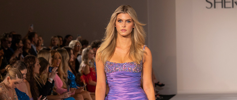 USC Department of Retailing student Augusta Roach models for Sherri Hill at a fashion show.