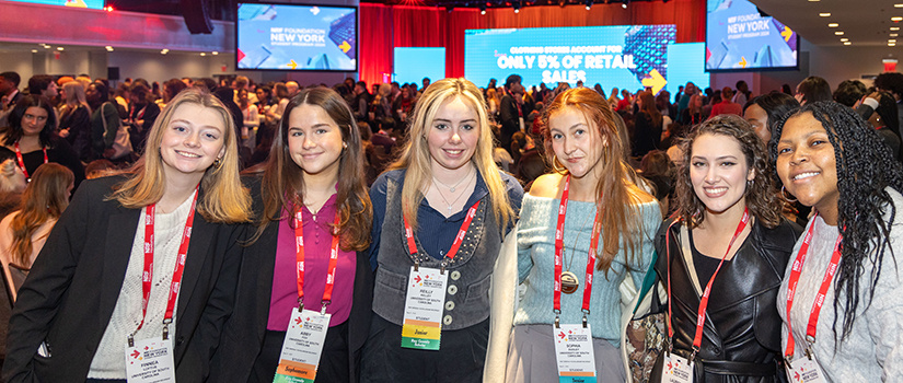 Six students pose together for a photo at the NRF conference in New York City.