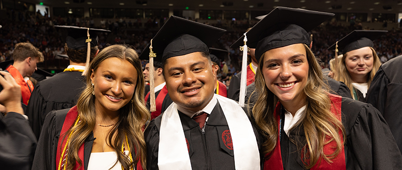 Three HRSM graduates pose