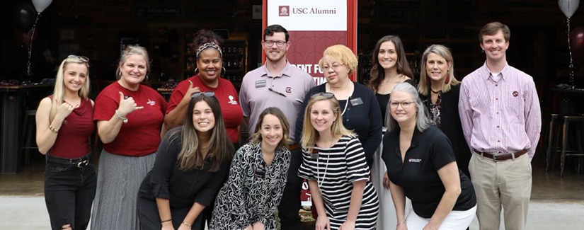 HRSM alumni and staff pose for a photo at a reconnect event in Greenville, South Carolina.