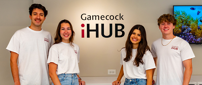 Four Department of Retailing students pose for a photo at the Gamecock iHub