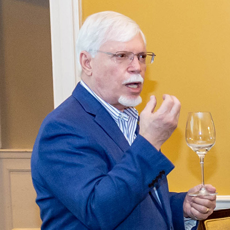 Emilio Guerra speaks to students in his Wine and Spirits in Food Service course at the McCutchen House.