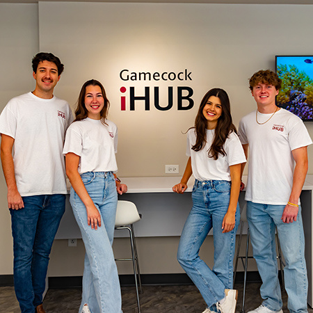 Four new interns pose for a photo at the Gamecock iHub.