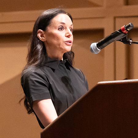 Nicole Tepper speaks into a microphone