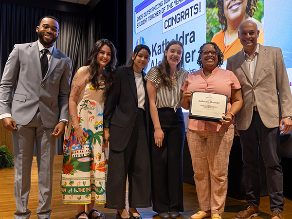 Katheldra Alexander with HRSM students and Dean Michael Sagas