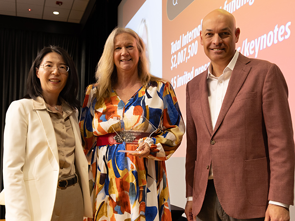 ori Pennington-Gray honored as Distinguished Researcher of the Year with colleagues on stage