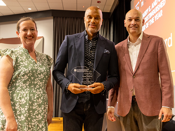 Donald Pollard receives Distinguished Teacher of the Year award with presenters at HRSM ceremony
