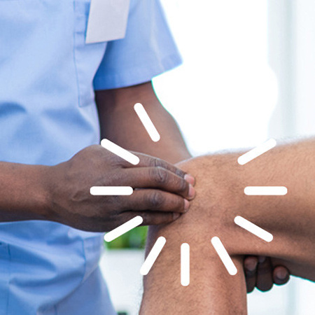 Healthcare provider examines a patient's knee.