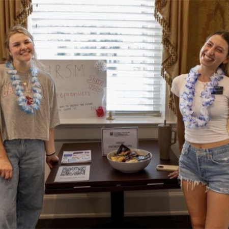 Two students pose at the HRSM Beach Bash