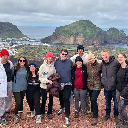 A group of students pose for a photo while visiting the sites in Iceland.