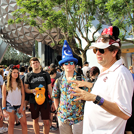 Professor Scott Smith speaks to students while giving them a tour of Walt Disney World.