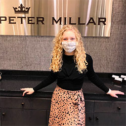 Bonnie Ayres stands in her Peter Millar office.