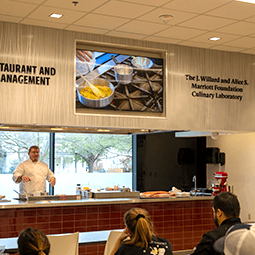 Instructor Robby Lybrand teaches a class in the J. Willard and Alice S. Marriott Culinary Laboratory. 