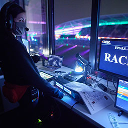 Megan Ryan working from the control booth at the Drone Racing League stadium