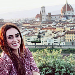 Kristy Martin sits on a ridge overlooking the Cathedral di Santa Maria del Fiore in Florence, Italy.