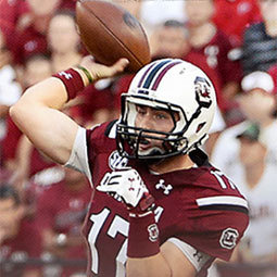 Dylan Thompson throws a pass during a UofSC football game
