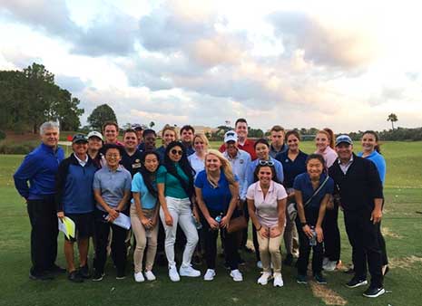 Students pose on a golf course they visited during CMAA's trip to Palm Beach