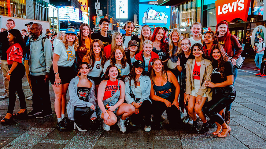 Students from several college across the United States gather for a group photo in Times Square during New York Fashion Week in September 2022.