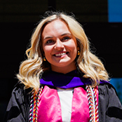 Image of Grace Tippett in her graduation gown