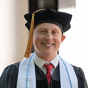 Image of William Raffone in his cap and gown