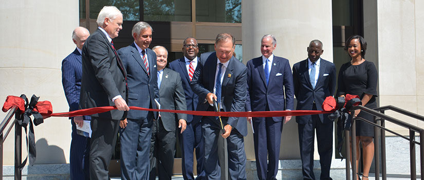 United States Supreme Court Justice Samuel Alito, surrounded by university and law school officials, cuts the ribbon for South Carolina Law's current home.