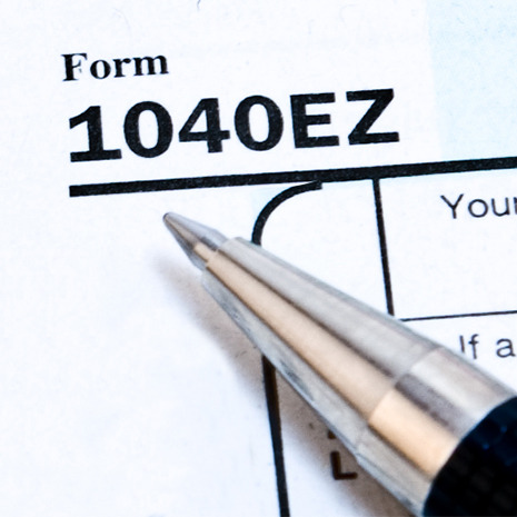 Pen resting on a 1040 EZ tax form