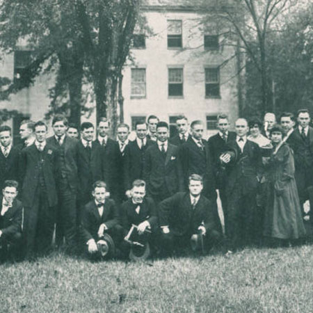 Historic photo of the Law Class of 1918, all white males except for two white female students.