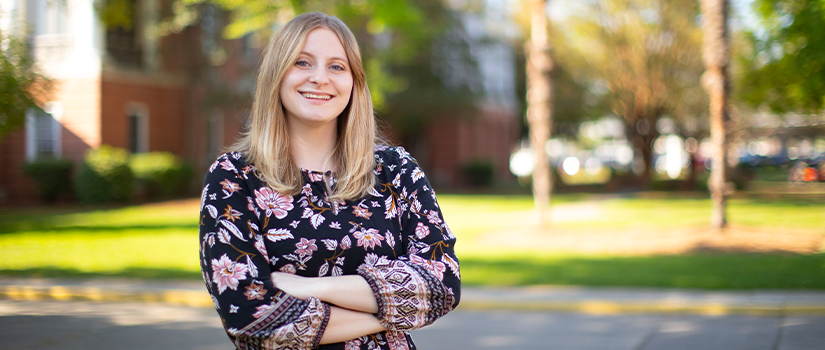 Ashton Farmer posing outside of the School of Medicine