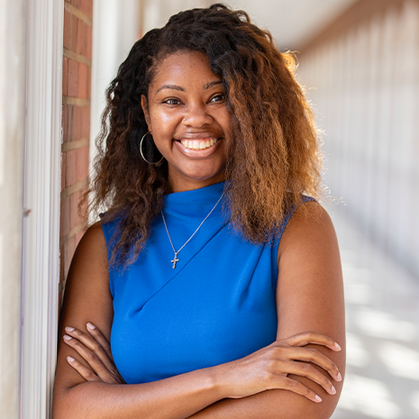 Jennifer Kidane posing in the hallway of the school of medicine