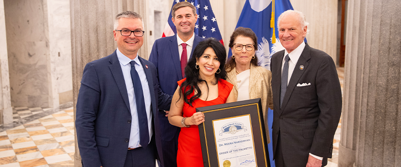 Dr. Meera Narasimhan posing with Governor McMaster and University officials