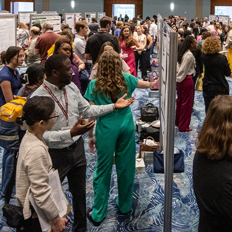 Research students at a poster competition