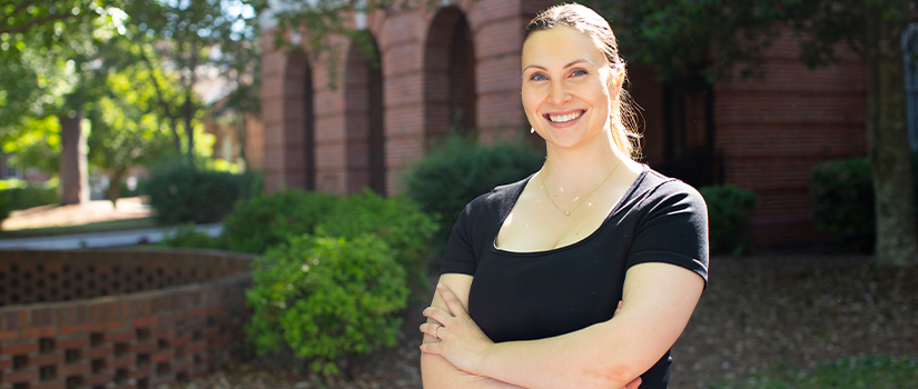 Stephanie Wilczynski posing outside of the School of Medicine