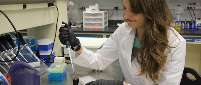 Student using a pipette. 