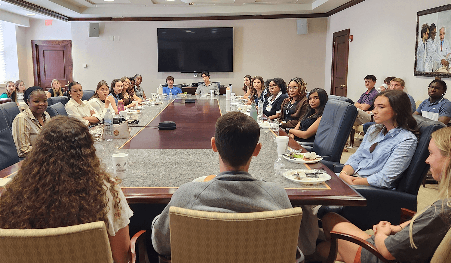Prospective med school students talking to current students in a panel setting