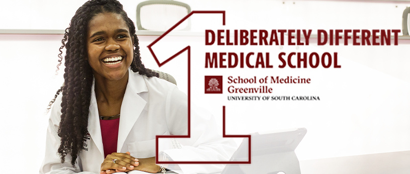 Female medical student in white coat smiling in lecture hall. One deliberately different medical school logo.
