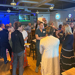 People mingling and talking. 